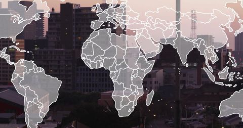 World map overlay on urban cityscape at dusk