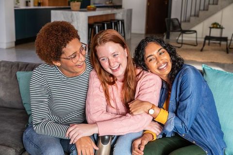 Diverse Friends Laughing Together in Cozy Modern Living Room