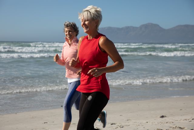 Senior Women Running on Beach Smiling - Download Free Stock Photos Pikwizard.com