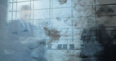 Blurred Business People Against Cloudy Office Background