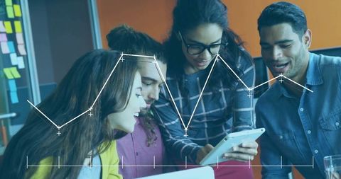 Team Analyzing Business Data on Tablet in Creative Office