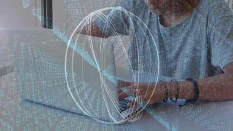 Boy Engaging with Binary Code Overlay while Using Laptop