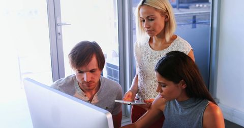 Diverse Team Collaborating on Project with Computer - Download Free Stock Images Pikwizard.com