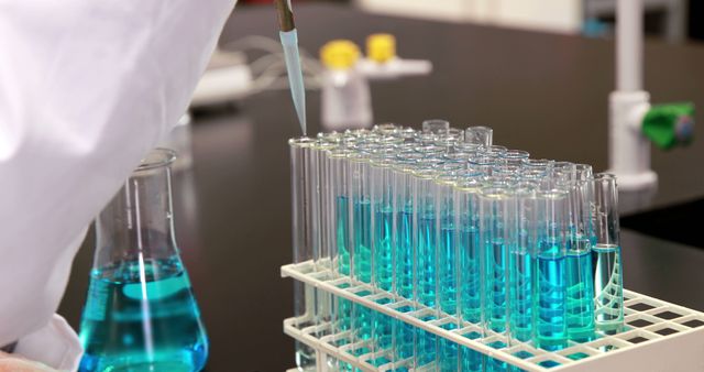 Scientist Conducting Laboratory Experiment with Test Tubes - Download Free Stock Images Pikwizard.com