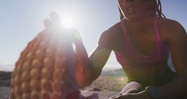 Female Athlete Stretching Outdoors in Morning Sunlight - Download Free Stock Images Pikwizard.com