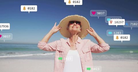 Senior Woman Enjoying Beach with Digital Connection Concepts