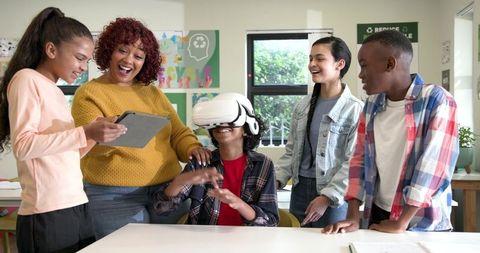 Children Engaging in Educational VR Experience with Teacher