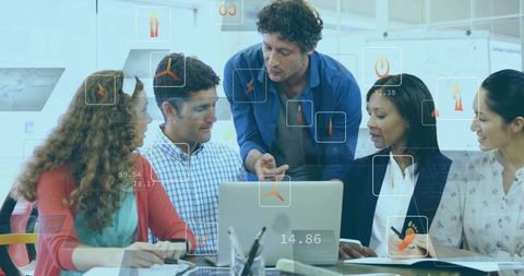Team collaborating around laptop with manager pointing and digital analytics overlays