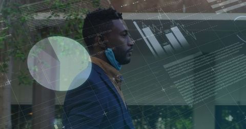 African American Businessman with Statistical Data Overlay