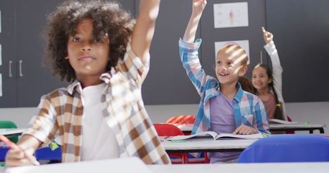 Excited Multiethnic Schoolchildren Raising Hands in Classroom - Download Free Stock Images Pikwizard.com