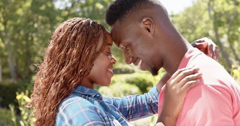 Affectionate African American Couple Smiling Enchanted in Love Outdoors