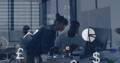 Coworkers Discussing Financial Data in Modern Office Environment