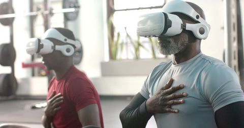 African american men practicing vr-guided breathing and mindfulness training in gym