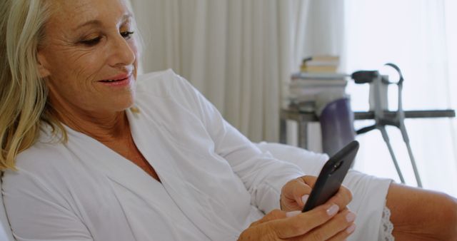 Senior Woman Relaxing in Bed Using Smartphone - Download Free Stock Images Pikwizard.com