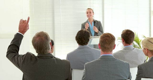 Businesswoman Leading Presentation with Engaged Audience - Download Free Stock Images Pikwizard.com