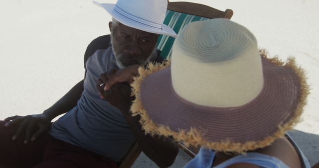 Mature Couple Relaxing Together on Beach Chairs with Straw Hats - Download Free Stock Images Pikwizard.com