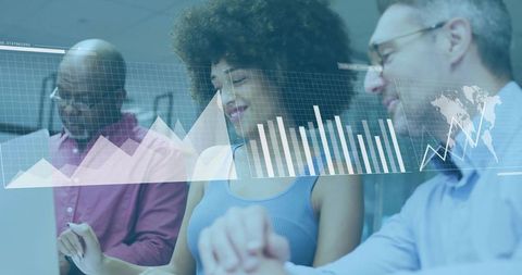 Business professionals collaborating over digital charts display