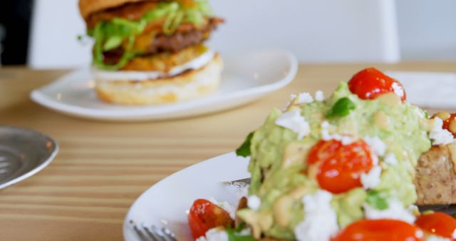 The image highlights avocado toast as a healthy choice against a blurred burger backdrop. - Download Free Stock Photos Pikwizard.com