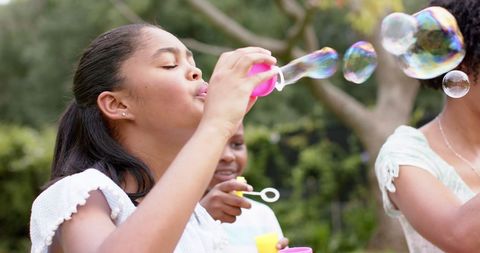 Children Blowing Soap Bubbles Outdoors on Sunny Day - Download Free Stock Images Pikwizard.com