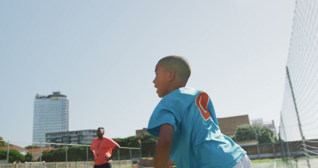 Boy Playing Tennis with Coach on Sunny Day - Download Free Stock Images Pikwizard.com