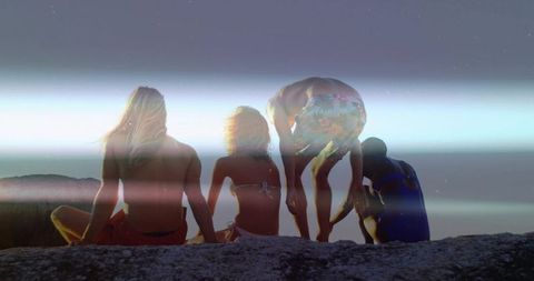 Gazing Friends on Coastal Cliff at Dusk with Silhouettes, Lens Flare, Summer Vibes