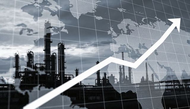 Rising market arrow crossing refinery silhouettes with global map grid at dawn