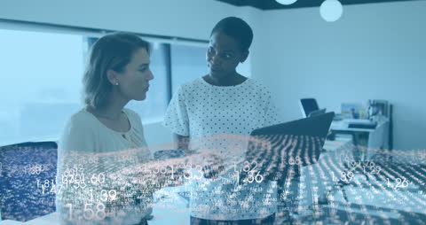 Businesswomen Analyzing Data with Digital Tech Interface Overlay