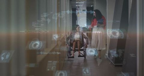 Caregiver pushing wheelchair user through futuristic corridor using holographic tablet display