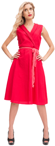 Elegant blonde posing confidently in vibrant red dress