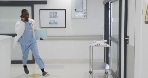 Doctor on Call Running Through Hospital Corridor - Download Free Stock Images Pikwizard.com