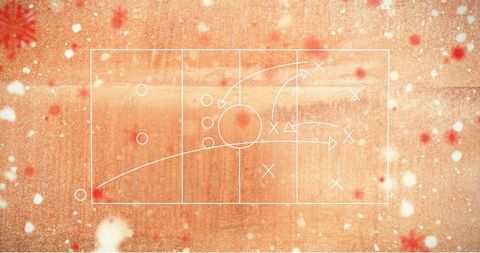 Chalk strategy diagram on wooden surface with snowflake motifs