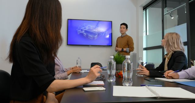 Diverse Team Discussing Architectural Plans in Conference Room - Download Free Stock Images Pikwizard.com