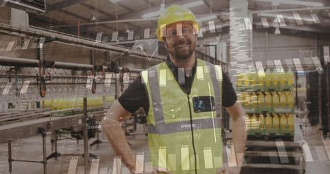 Smiling factory supervisor monitoring production line with digital analytics overlay