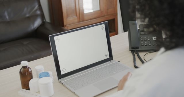 Doctor Telehealth Consultation with Empty Laptop Screen in Medical Office - Download Free Stock Images Pikwizard.com