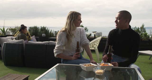 Young Friends Enjoying Drinks on Modern Outdoor Terrace - Download Free Stock Images Pikwizard.com