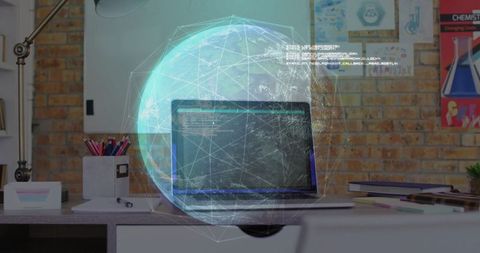 Holographic globe with laptop on office desk