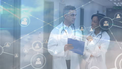 Two Doctors Discussing in High-Tech Hospital Corridor