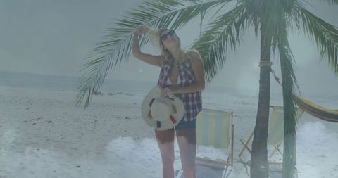 Woman enjoying sunny day at tropical beach