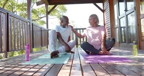 Senior Couple Embracing Healthy Lifestyle with Yoga Outdoors