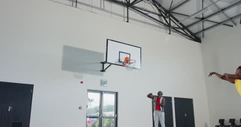 Basketball Player Shooting Indoors: Precision and Practice