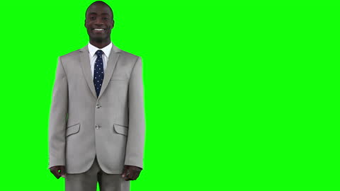 Confident Businessman in Suit Against Green Background