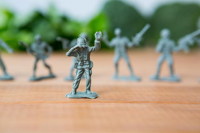 Miniature figurine of army soldier with binocular in battle