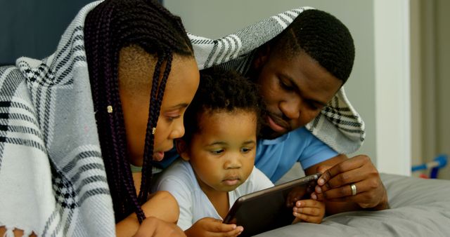 Family Using Tablet Together Under Blanket - Download Free Stock Images Pikwizard.com