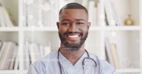 Smiling doctor amidst digital data graphics