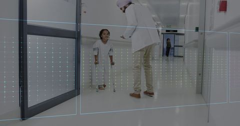 Doctor Interacting with Disabled Child in Hospital Corridor