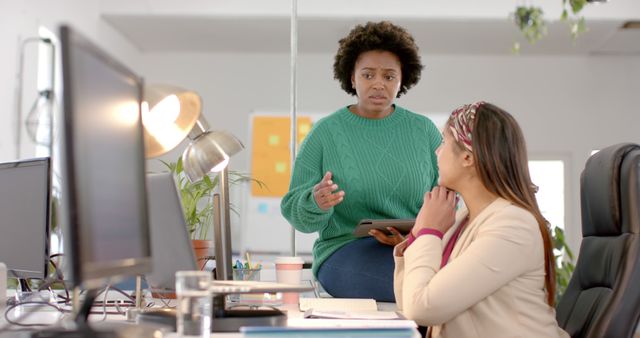 Colleagues Having a Serious Discussion in Office Environment - Download Free Stock Images Pikwizard.com