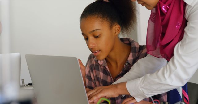 Young Student Learning with Mentor, Laptop and hands-on Guidance - Download Free Stock Images Pikwizard.com