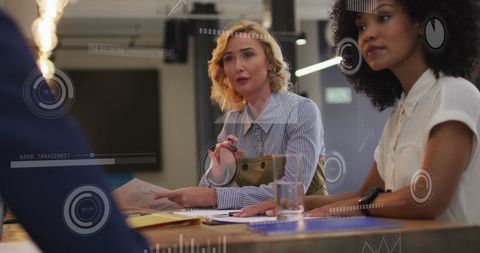 Diverse Coworkers Sharing Ideas with Digital Interface Overlay in Modern Office