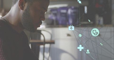 Person analyzing medical technology in modern cafe setting