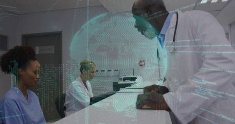 Senior physician guiding nursing staff with digital innovation at clinic